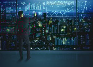 Businessman drawing business statistics on glass wall-1