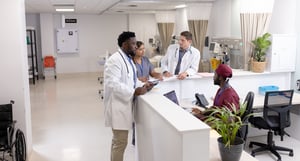 diverse-doctors-and-medical-staff-talking-at-recep-2026-01-09-09-52-16-utc